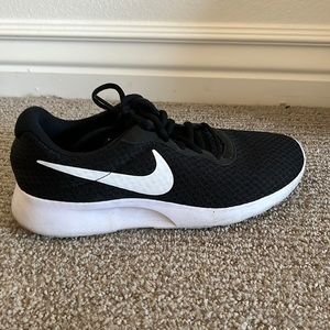 Black Nike running shoes.